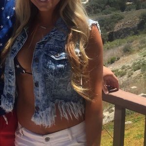 Distressed denim vest